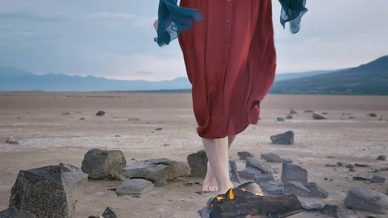 Stock Video Meditating In The Middle Of A Desert With A Campfir Animated Wallpaper - Free Download