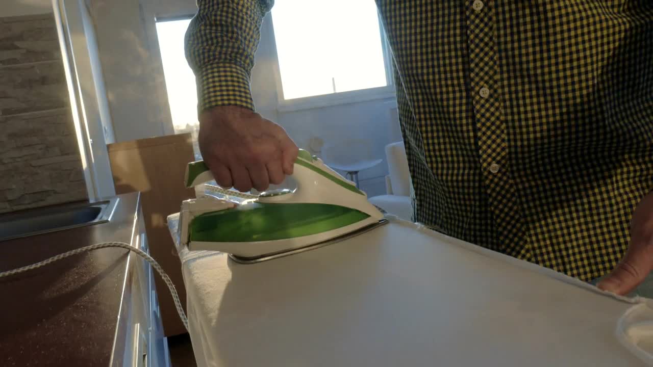 Stock Video Ironing A Shirt At Home Animated Wallpaper - Free Download