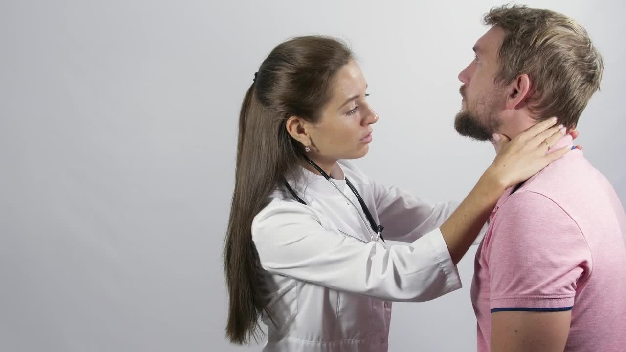 Stock Video Female Doctor Inspecting A Young Man Live Wallpaper For PC - Free Download