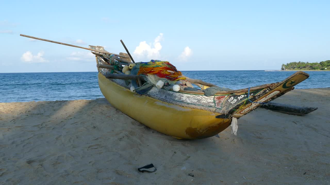 Free Video Stock traditional yellow fishing boat at the beach Live Wallpaper - Free Download