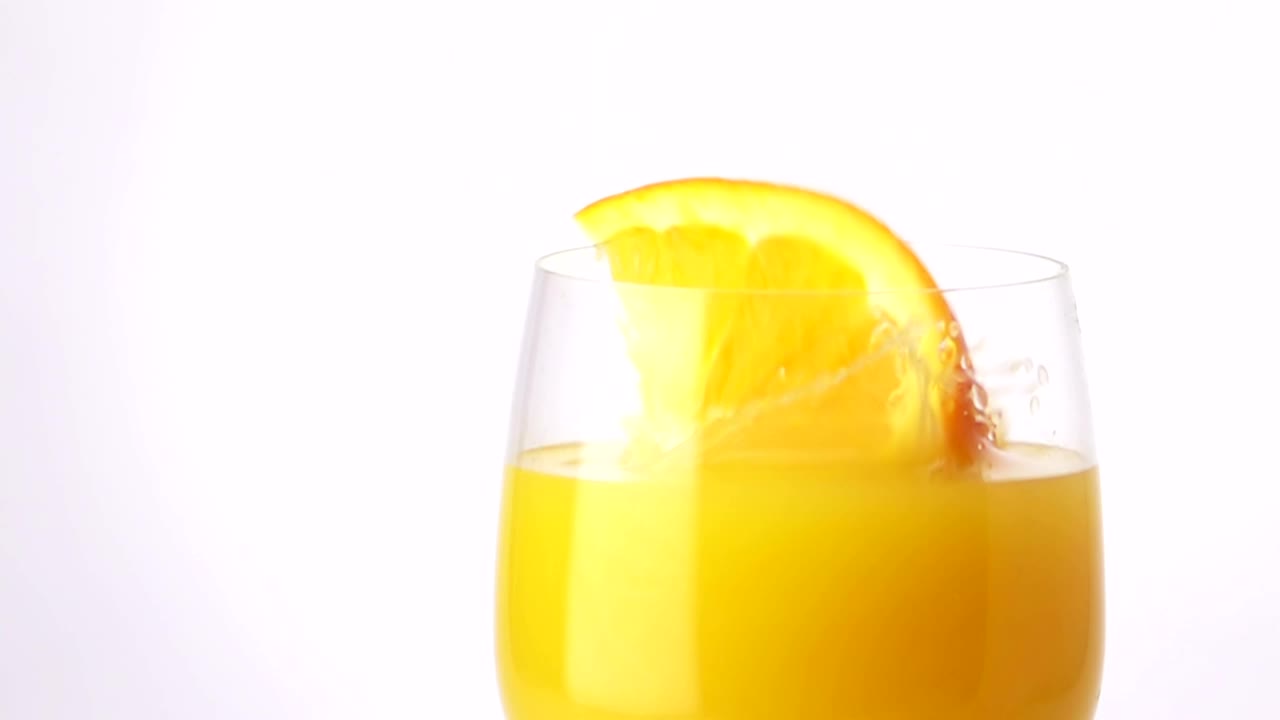 Free Video Stock Slice Of Orange Falling Into The Juice Live Wallpaper - Free Download