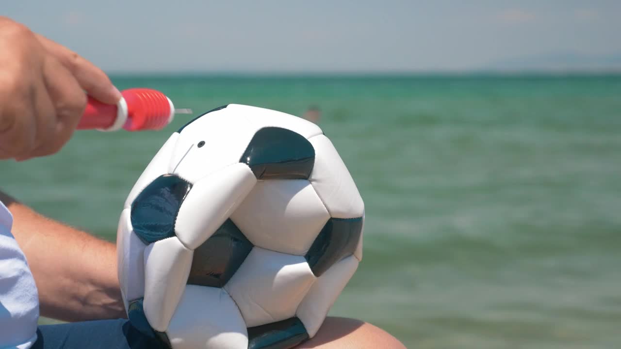 Stock Video Inflating A Ball For A Beach Game Animated Wallpaper - Free Download