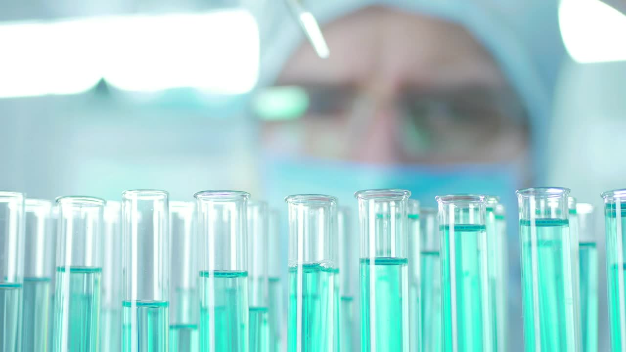 Stock Video Doctor Extracting Liquid From The Lab Tubes Live Wallpaper For PC - Free Download