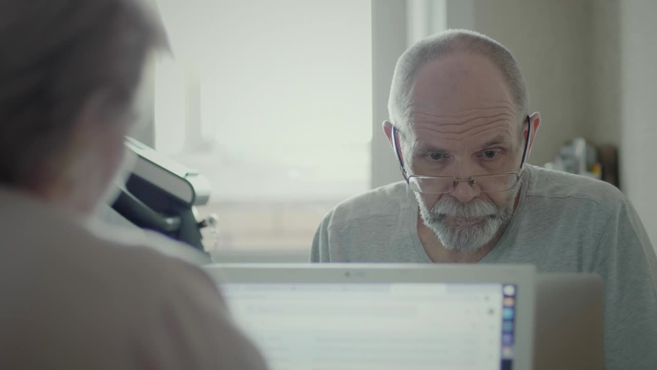 Free Stock Video Senior Man Reading Information On The Computer Live Wallpaper - Free Download
