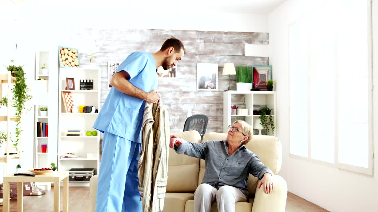 Stock Video Nurse Helps Elderly Woman Stand Up And Walk Live Wallpaper - Free Download