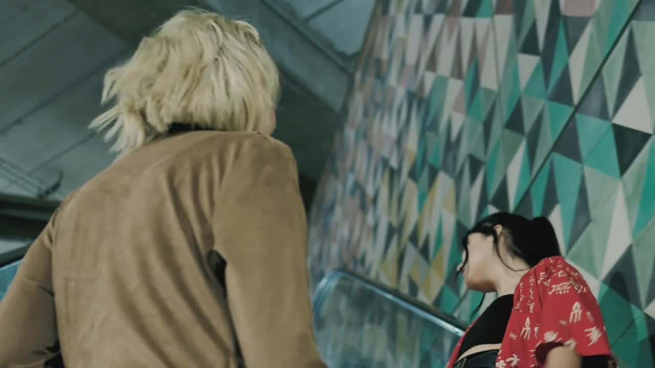 Stock Video Pair Of Girls On An Escalator Live Wallpaper - Free Download