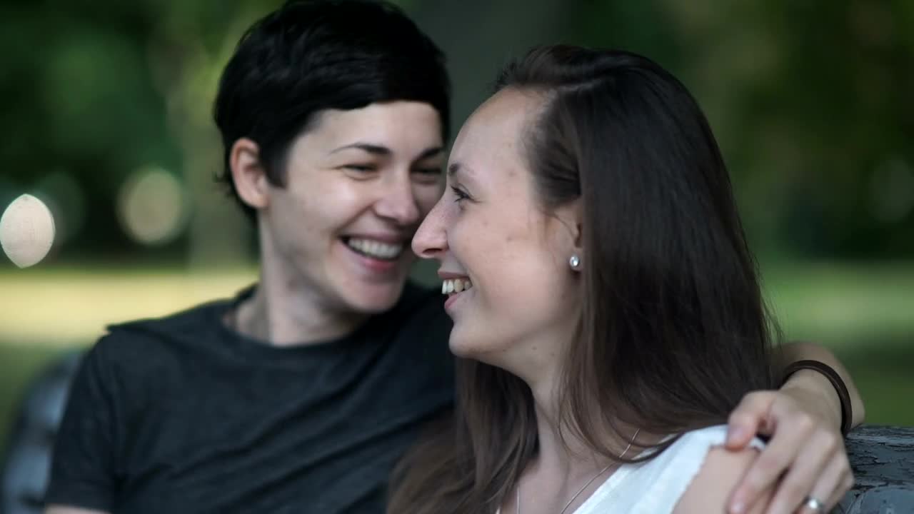 Stock Video Lgtbq Women Kiss And Talk On Park Bench Animated Wallpaper - Free Download