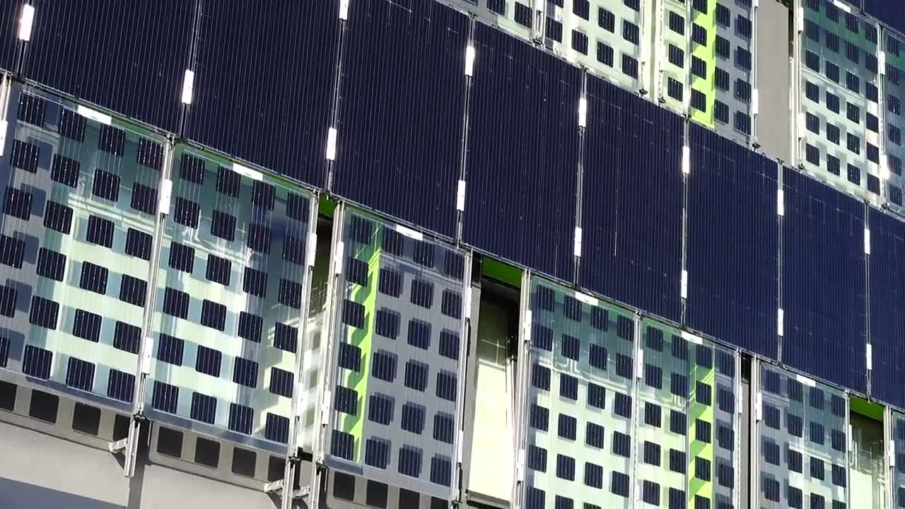 Free Video Stock Solar Panels Attached To The Side Of A Building Live Wallpaper - Free Download
