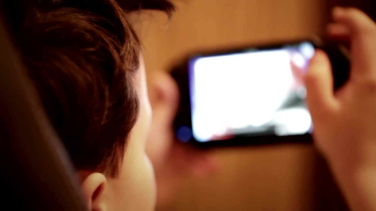 Free Video Stock teenager playing games in a chair Live Wallpaper - Free Download