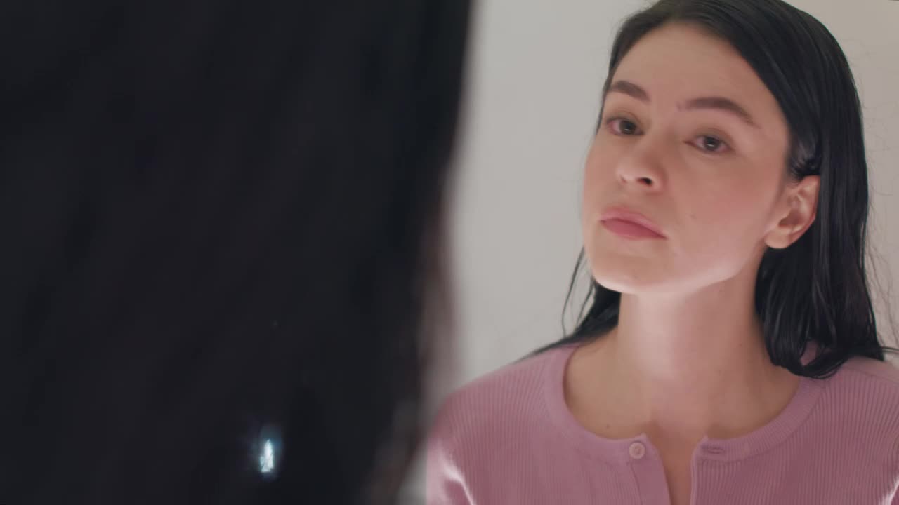 Free Stock Video Woman Putting On Her Earrings In Front Of The Mirror Live Wallpaper - Free Download
