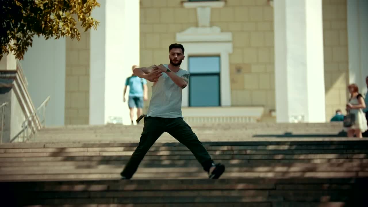 Free Video Stock Stylish Man With Tattoos Dancing On The Stairs Live Wallpaper - Free Download