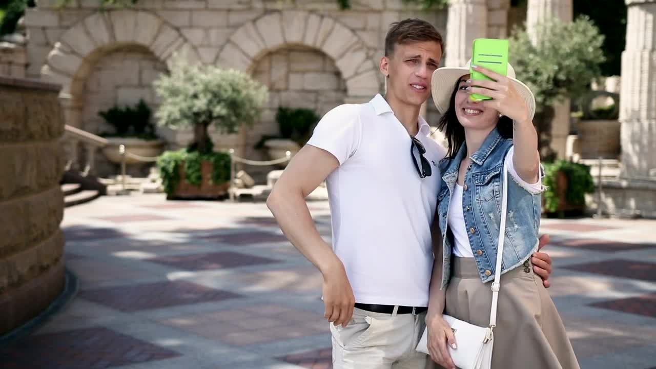 Stock Video Couple Taking Selfies During A Walk Live Wallpaper For PC - Free Download