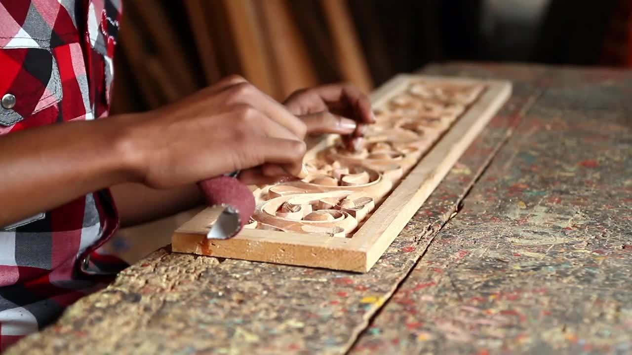 Stock Video Man Sanding A Wooden Carvin Animated Wallpaper - Free Download