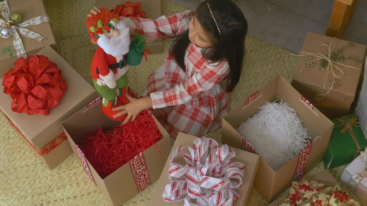 Stock Video Little Girl Opening Gifts At Christmas Animated Wallpaper - Free Download