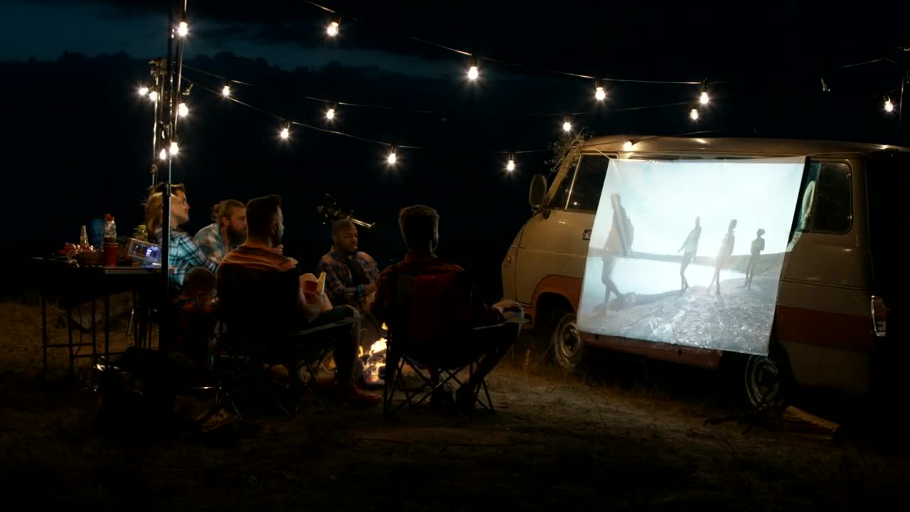 Stock Video Group Of Friends Watching A Movie With A Projector Live Wallpaper For PC - Free Download