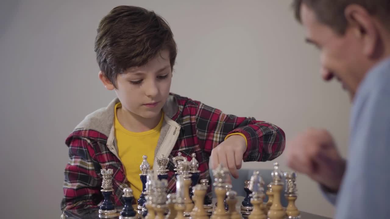 Stock Video Man Teaches Young Boy How To Win At Ches Animated Wallpaper - Free Download