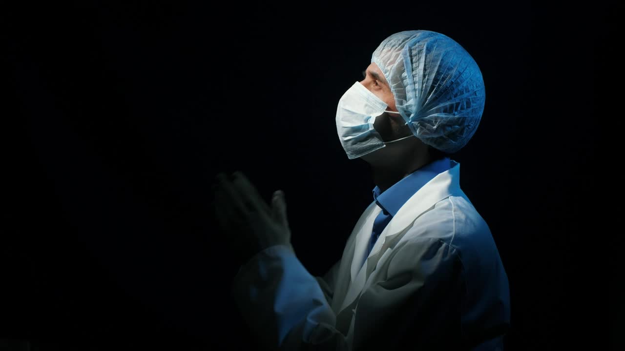 Stock Video Doctor Praying In A Dark Room Looking At Sky Live Wallpaper For PC - Free Download