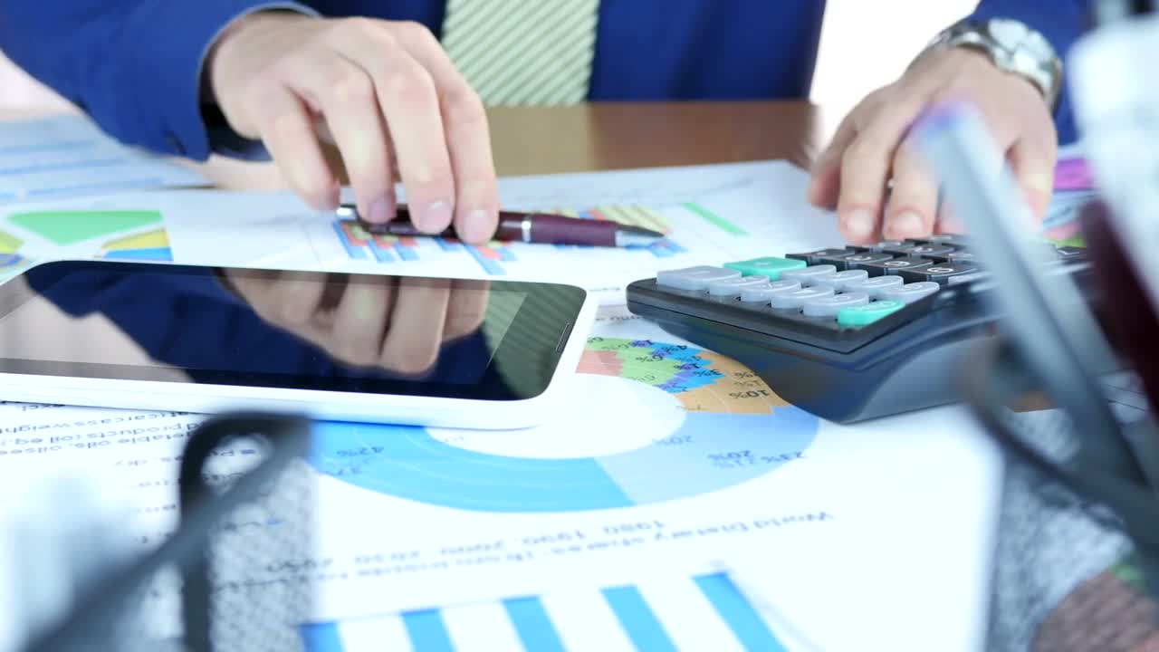 Stock Video Man Reviewing And Rectifying Graph Animated Wallpaper - Free Download