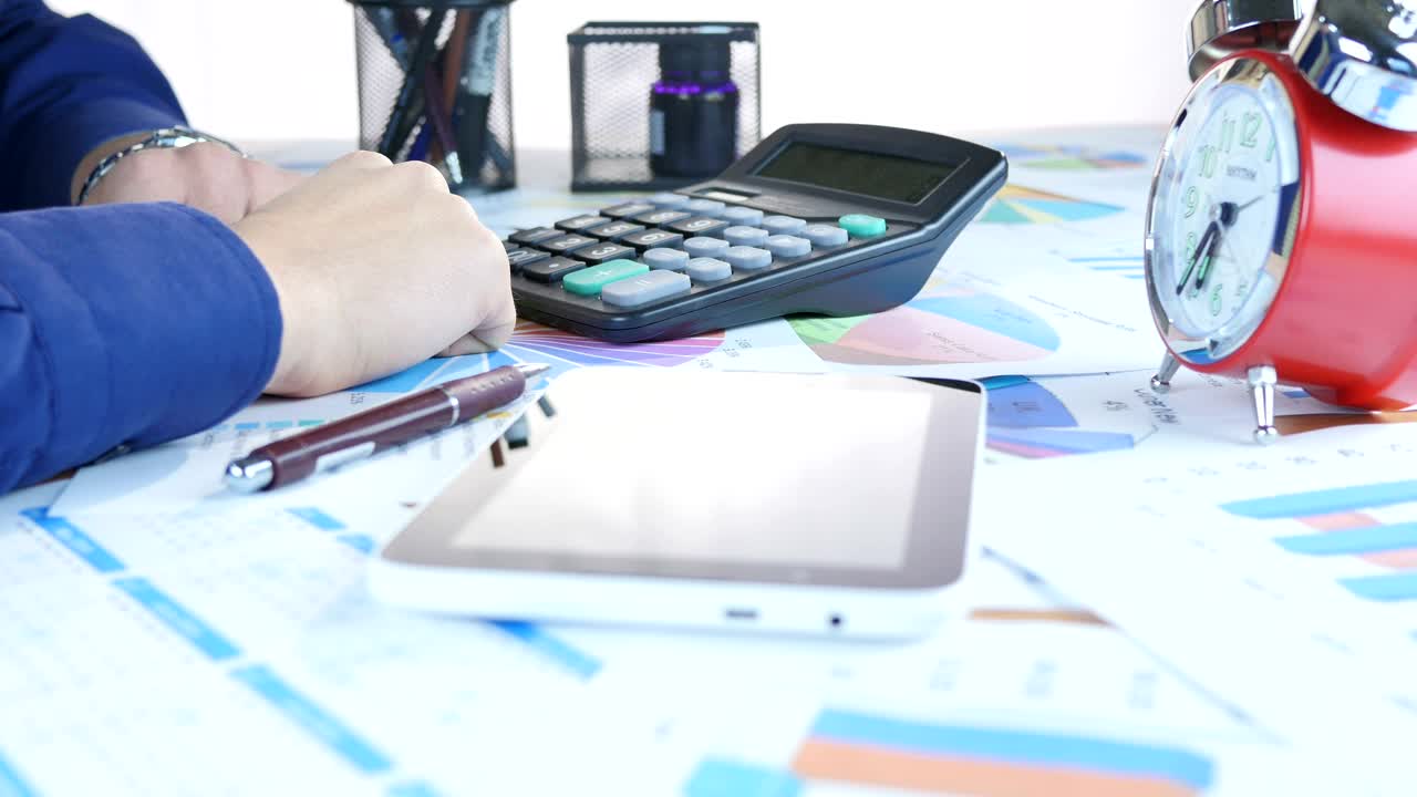 Stock Video Person Doing Accounts And Graphs On A Table Live Wallpaper - Free Download