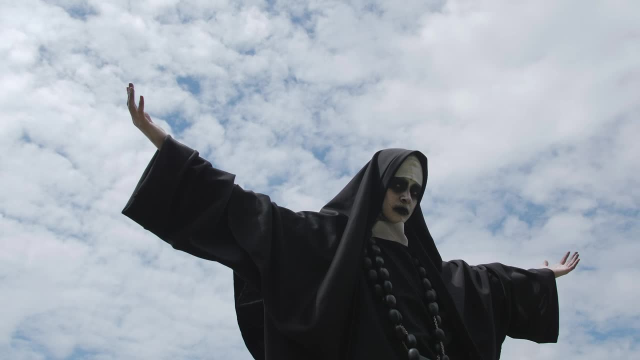 Free Stock Video Woman In Nun Costume On A Cloudy Day Live Wallpaper - Free Download