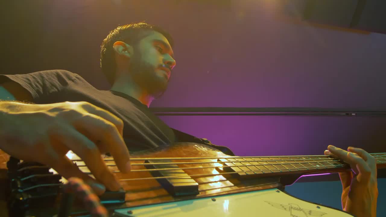 Stock Video Low View Of A Musician With His Electric Bass Animated Wallpaper - Free Download
