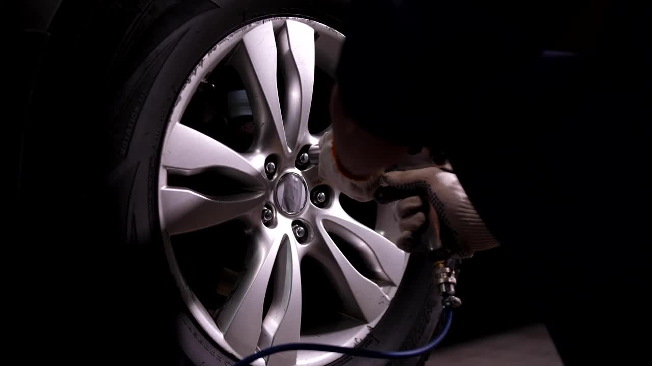 Free Video Stock taking a wheel off of a car Live Wallpaper - Free Download