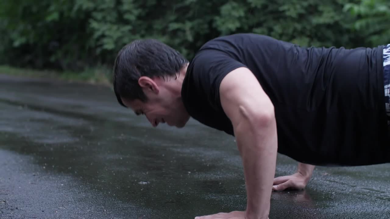 Stock Video Man Doing Hard Push Ups In The Rain Animated Wallpaper - Free Download