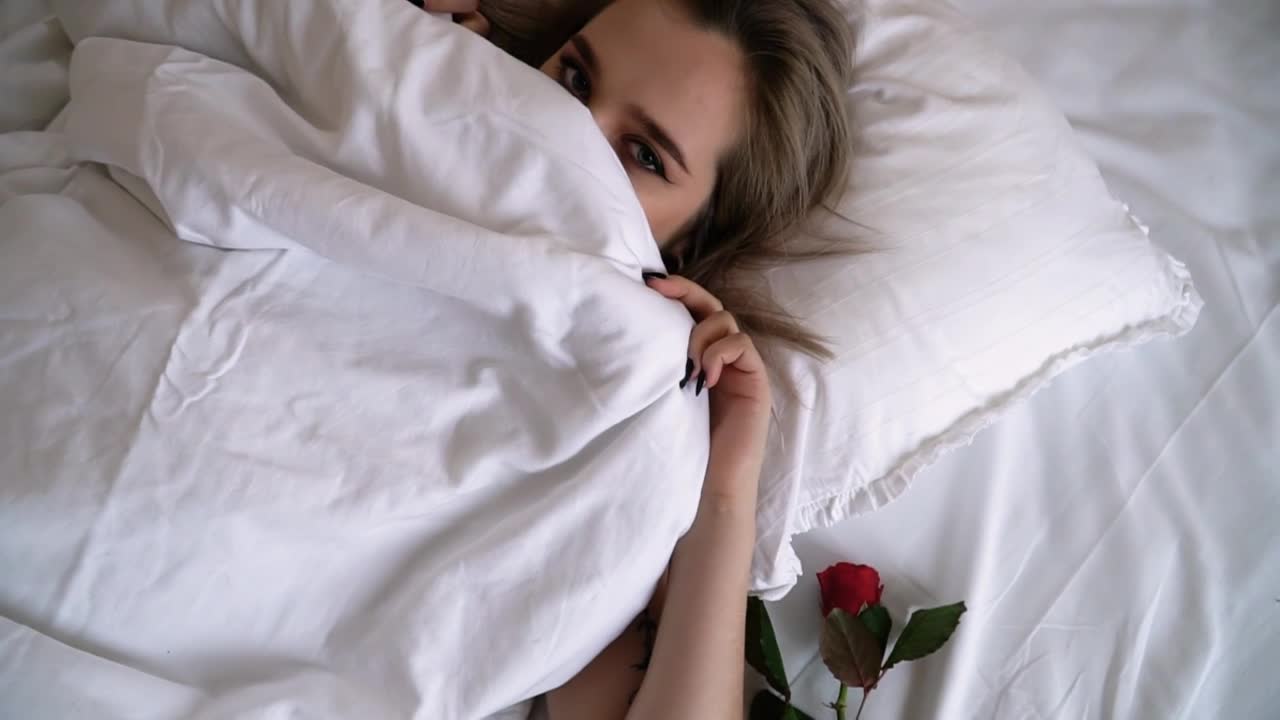 Stock Video Beautiful Woman In Bed Covers Face And Winks Live Wallpaper For PC - Free Download