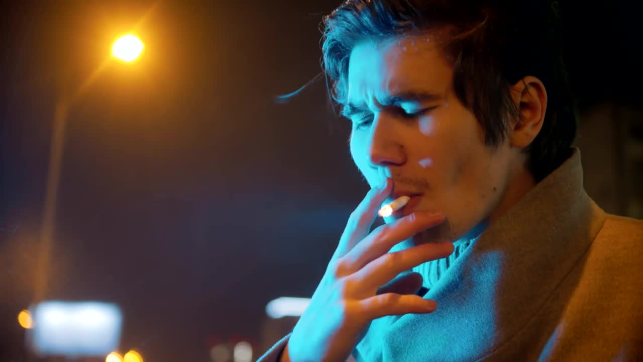 Stock Video Face Of A Young Man Smoking On A Rainy Night Live Wallpaper For PC - Free Download