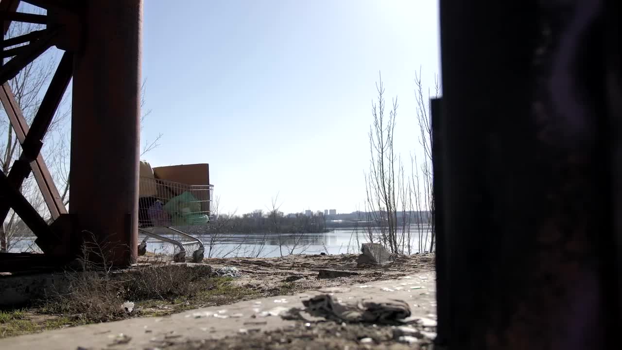 Stock Video Homeless Man With A Shopping Cart Under A Bridge Animated Wallpaper - Free Download