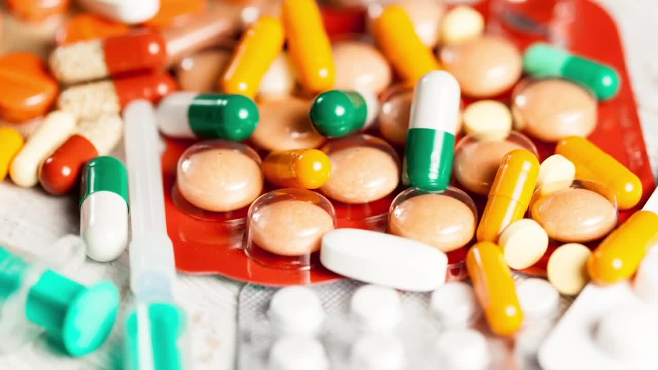 Stock Video Orange And Green Pills On Pharmacy Counter Live Wallpaper - Free Download