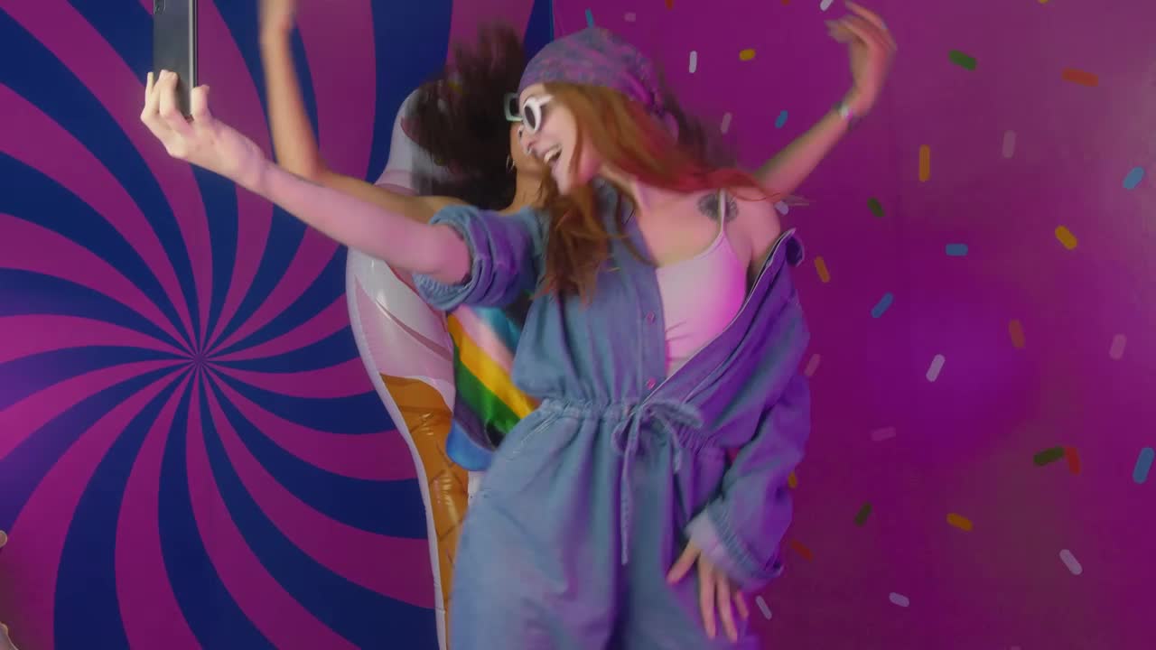 Stock Video Girls Recording Themselves Dancing In A Colorful Place Live Wallpaper For PC - Free Download
