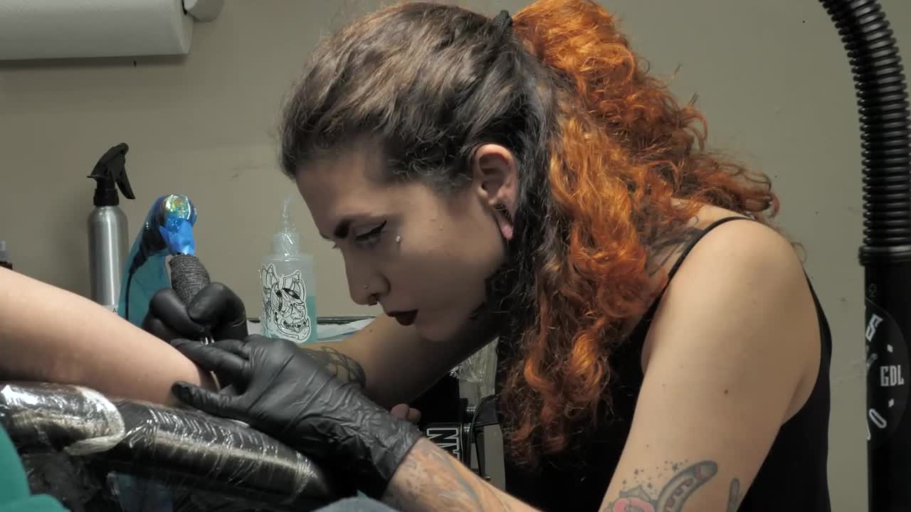 Free Video Stock tattoo artist working on a customer Live Wallpaper - Free Download