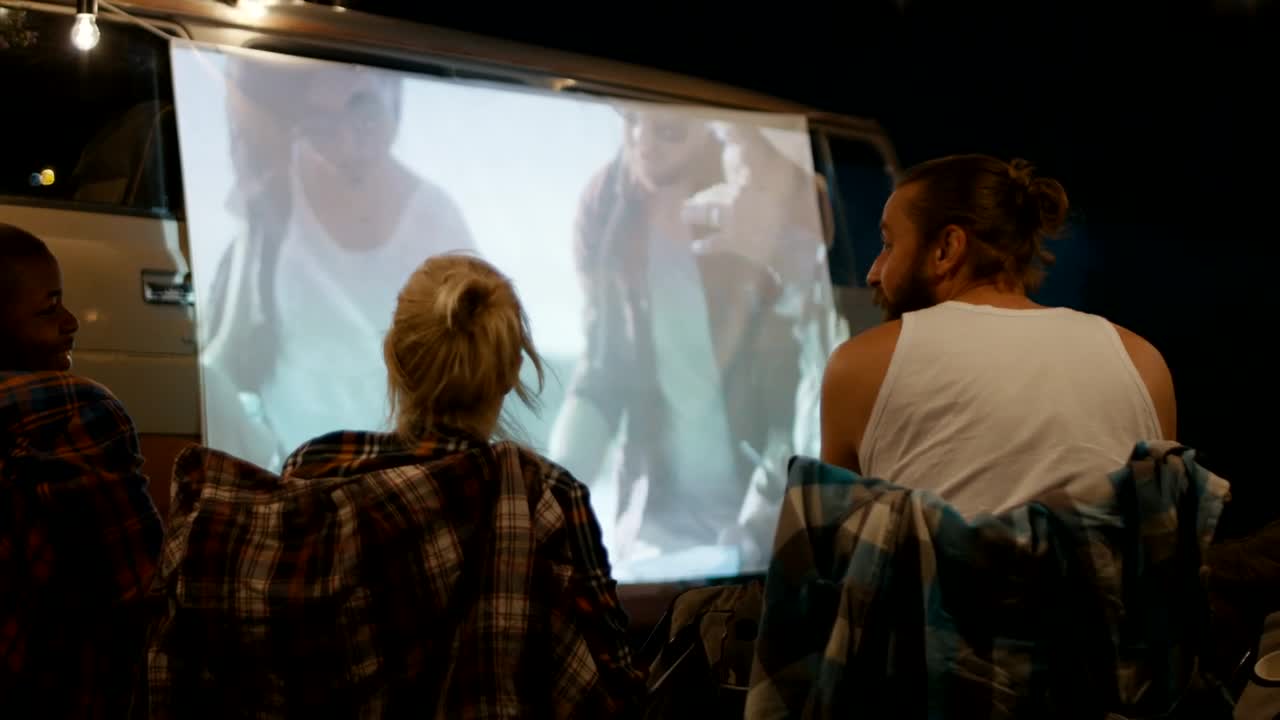 Stock Video Friends Watching A Movie At The Campsite Live Wallpaper For PC - Free Download