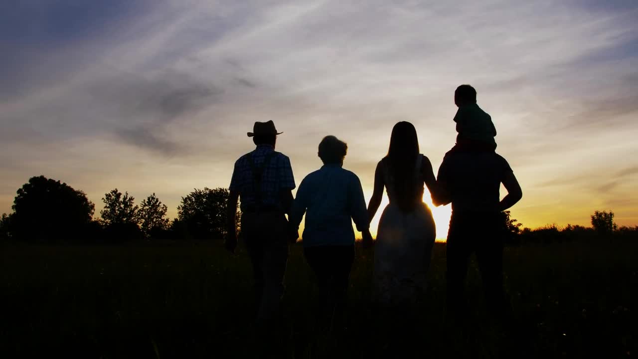 Free Video Stock three generations walking together at sunset Live Wallpaper - Free Download