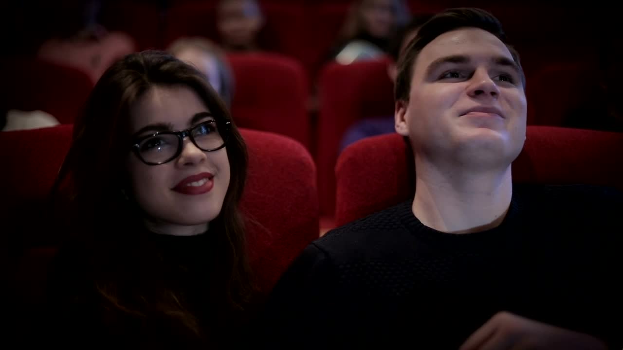 Stock Video Couple In Love Watching A Movie At The Cinema Live Wallpaper For PC - Free Download