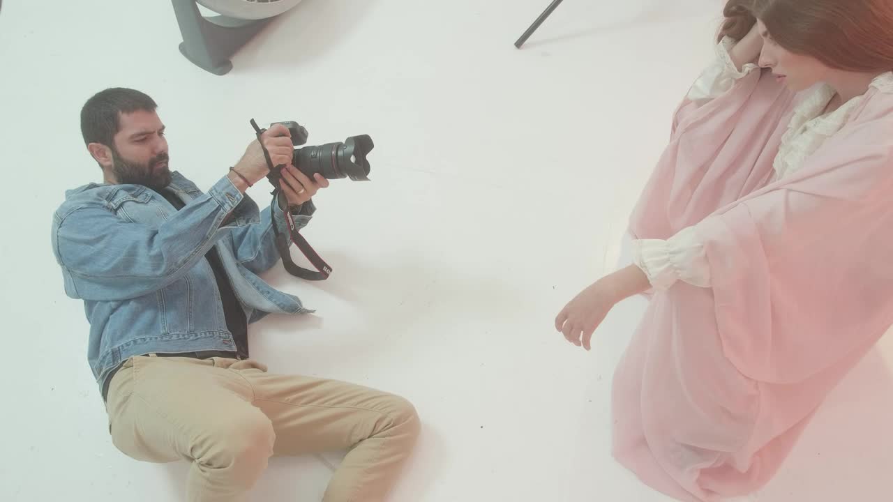 Stock Video Experienced Photographer Portraying A Girl On Set Live Wallpaper For PC - Free Download