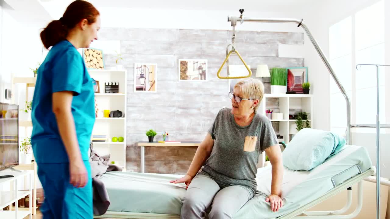Stock Video Elder Care Nurse Helps Woman To Bed Live Wallpaper For PC - Free Download