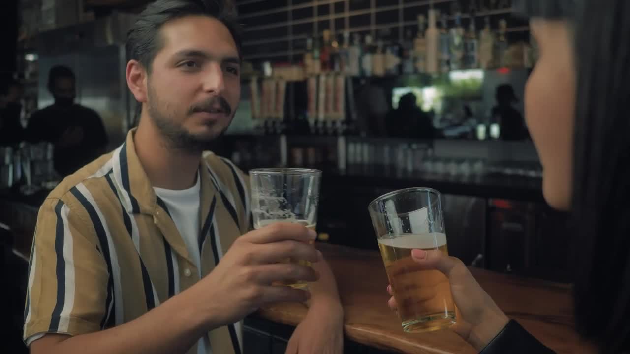 Stock Video Man Drinking Beer With His Date Animated Wallpaper - Free Download