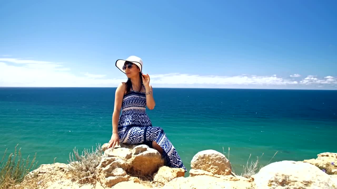 Free Video Stock tourist posing on the seashore Live Wallpaper - Free Download