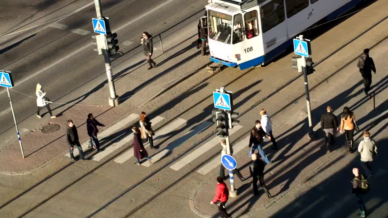 Stock Video Pedestrians Walking By A Tram Live Wallpaper - Free Download