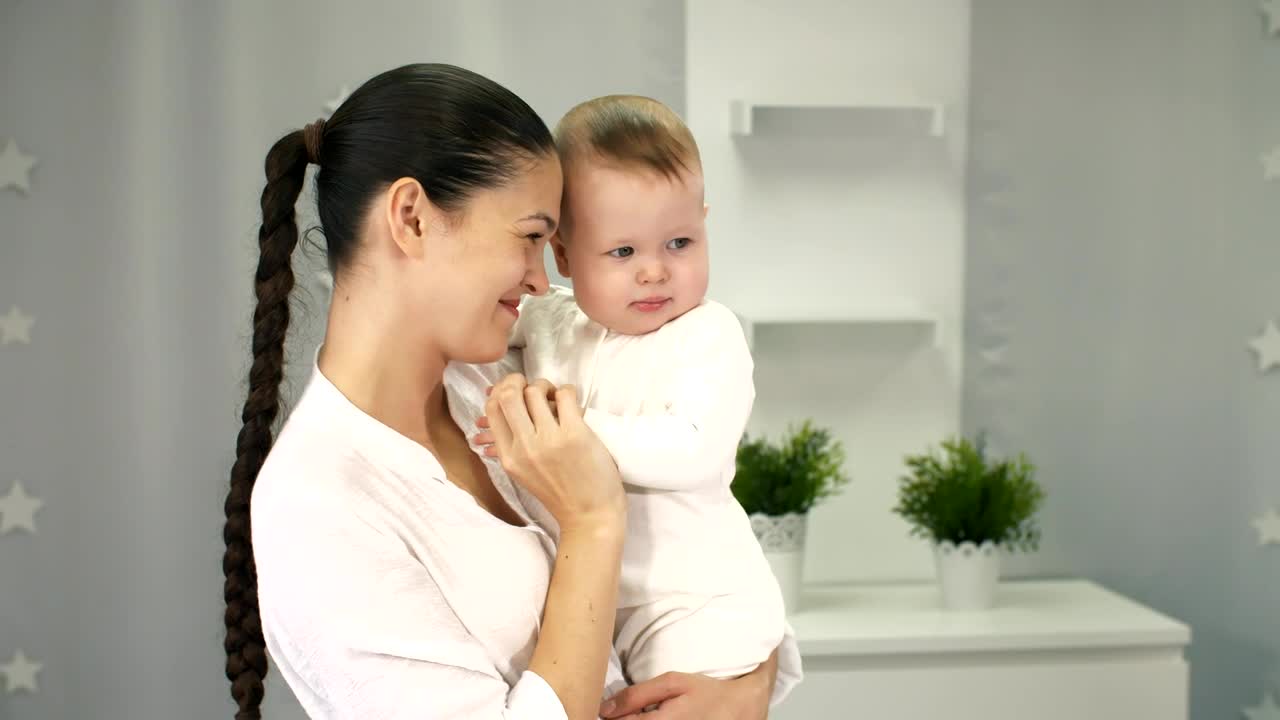 Stock Video Happy Mother Holding Her Little Baby In Arms Animated Wallpaper - Free Download