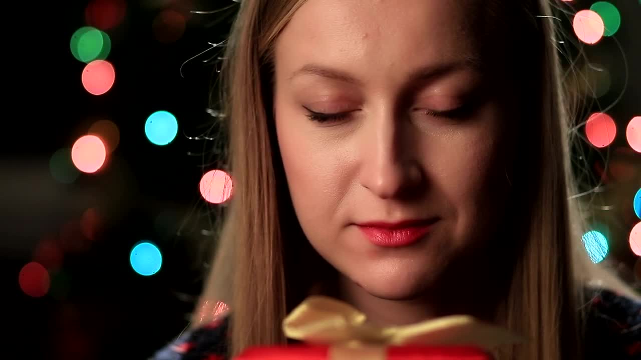 Stock Video Happy Woman Holding A Gift Animated Wallpaper - Free Download