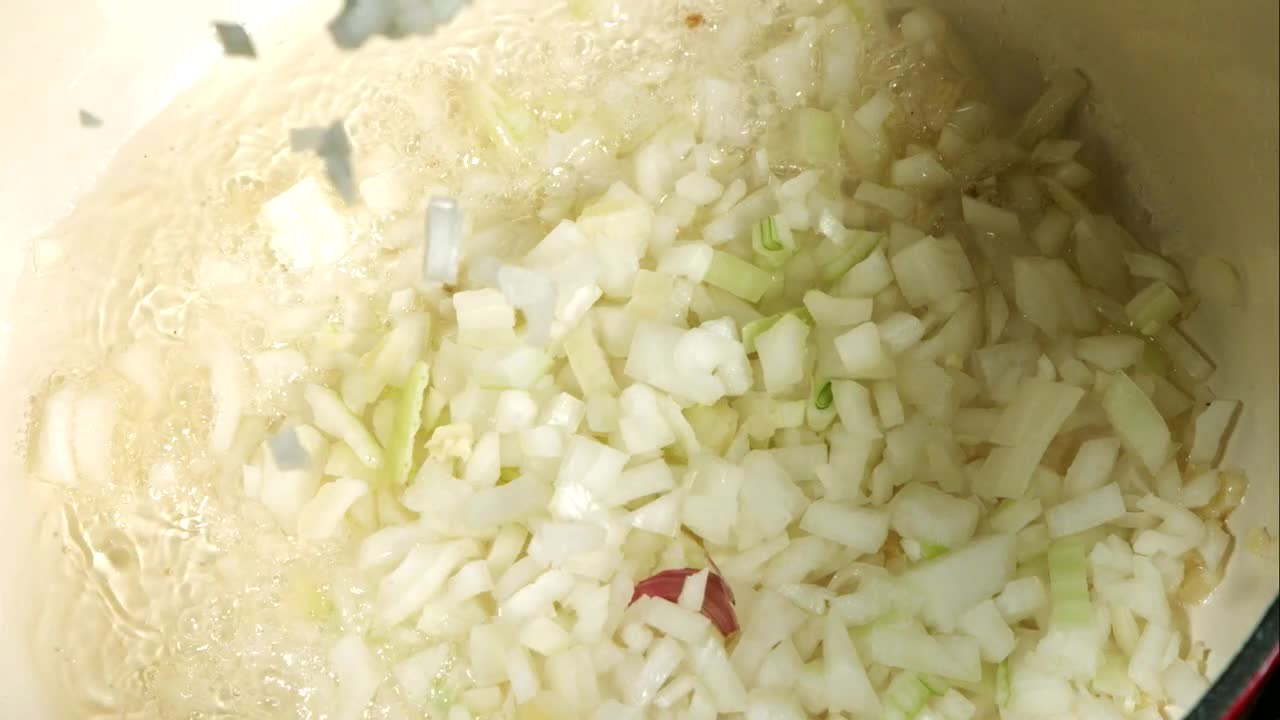 Stock Video Onion Slices Falling Into The Pan In Slow Motion Live Wallpaper - Free Download