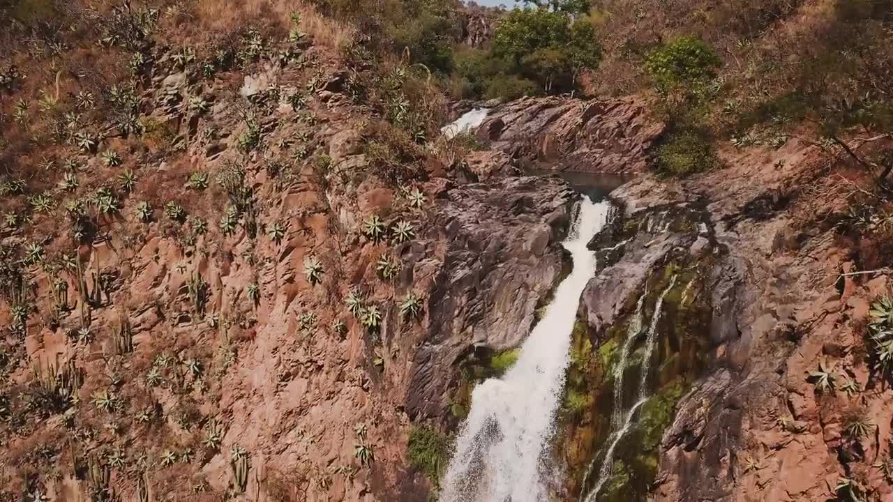 Stock Footage Waterfall Over Red Rocks Creating A Rainbow Live Wallpaper - Free Download