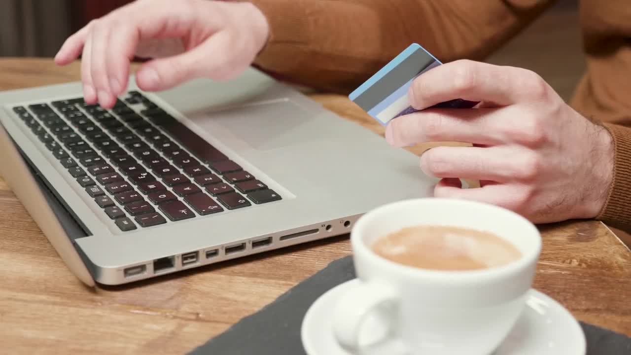 Stock Video Man Using Online Pay With Credit Card In Caf Animated Wallpaper - Free Download