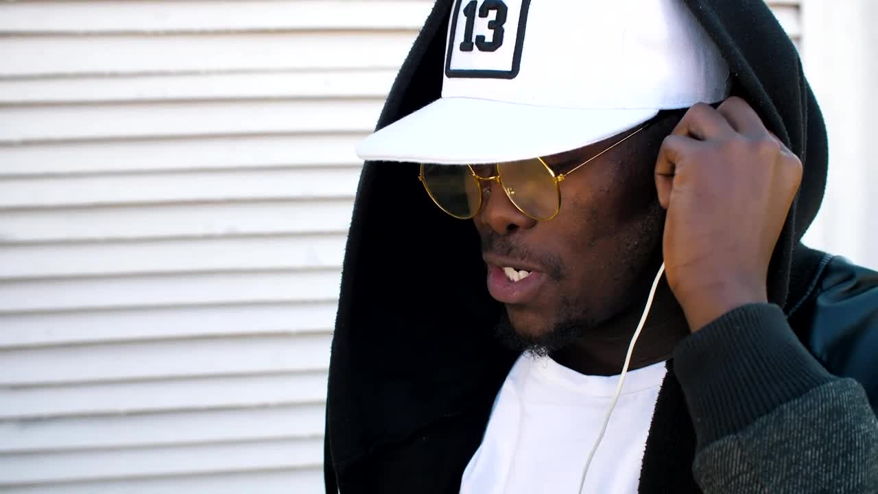 Video Stock Rapper Puts On Headphones To Listen To Music Live Wallpaper Free - Free Download