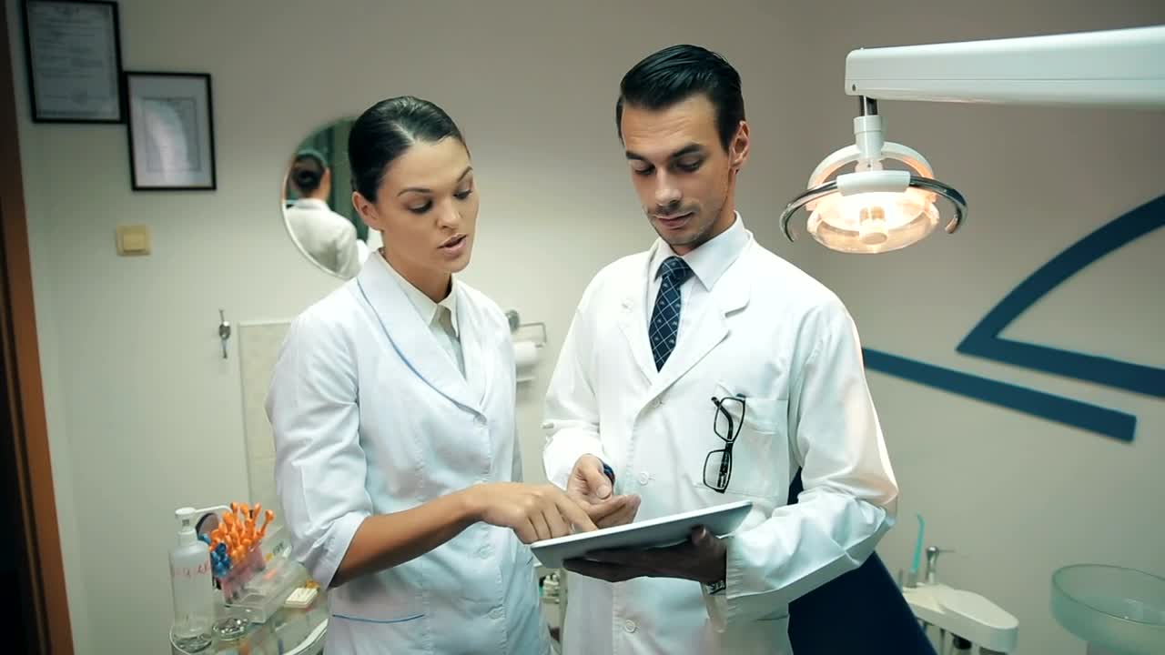 Stock Video Couple Of Dentists Checking An X Ray Live Wallpaper For PC - Free Download