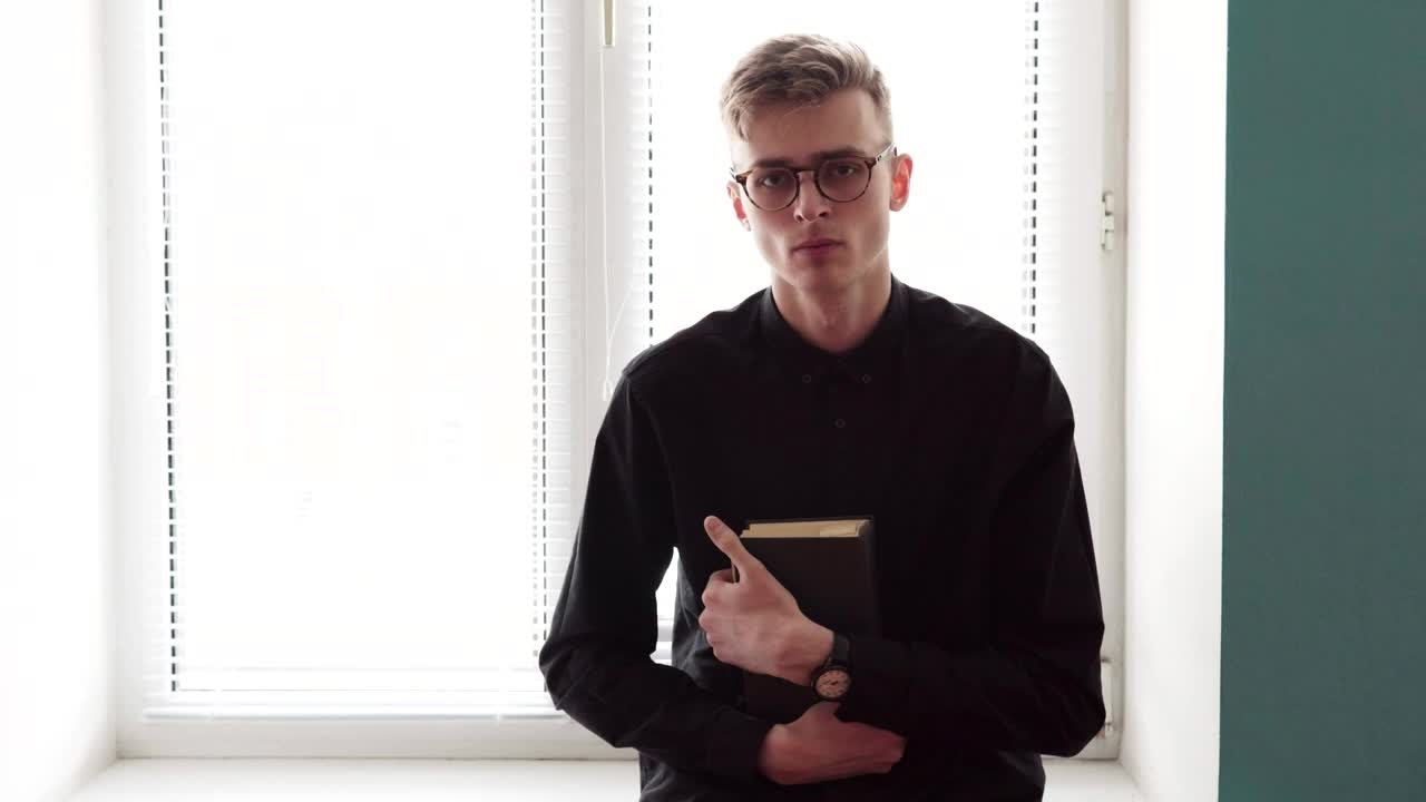 Stock Video Man Holding A Bible In Both Hands Animated Wallpaper - Free Download