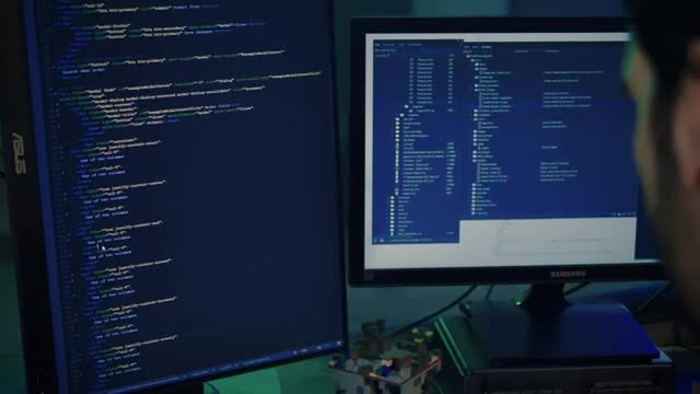 Stock Video Experienced Programmer Working On A Large Computer  Smal Live Wallpaper For PC - Free Download